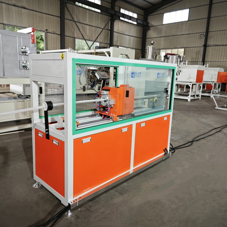Industrial pipe extrusion machinery operating on a factory floor